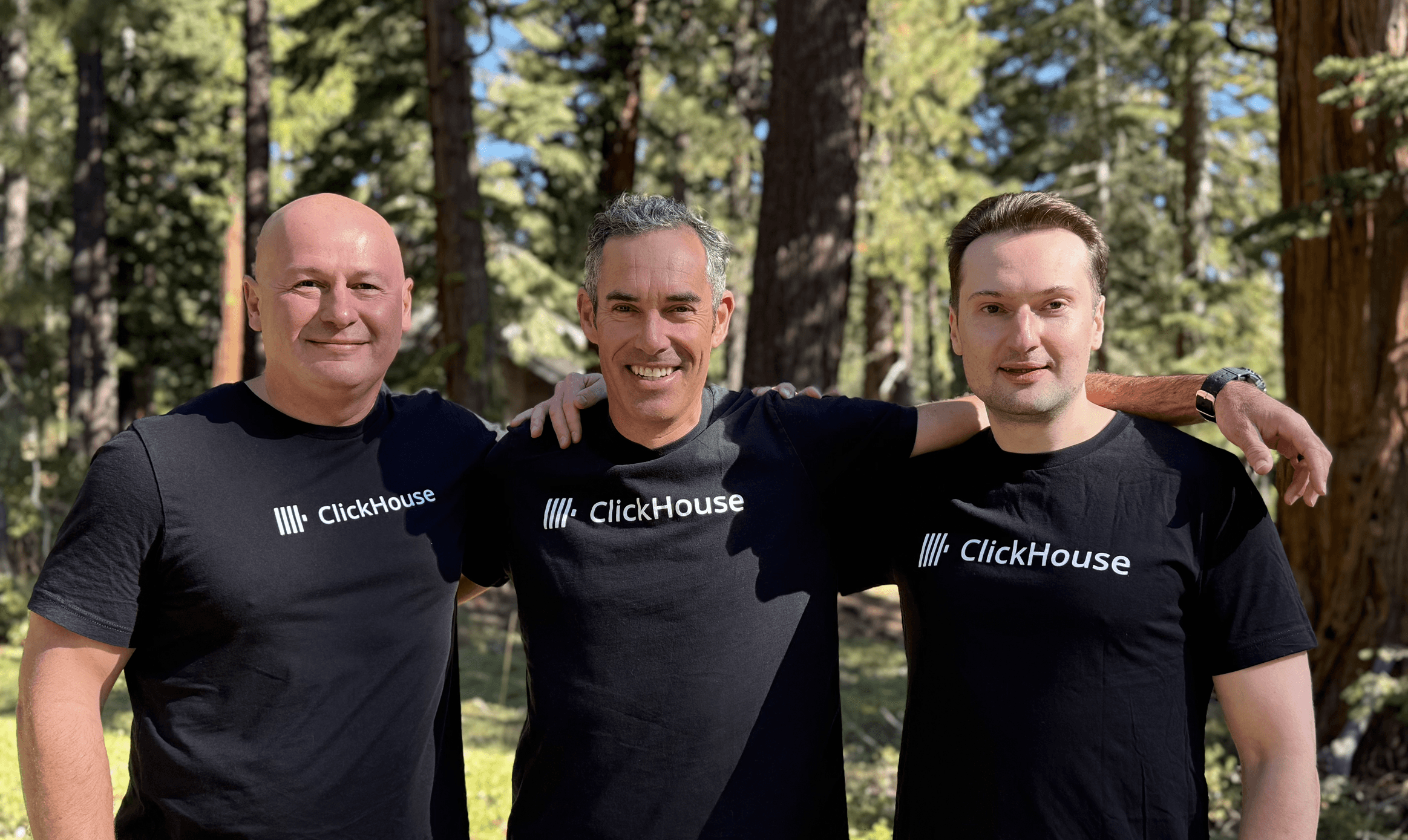 ClickHouse co-founders Aaron Katz, Alexey Milovidov, and Yury Izrailevsky wearing ClickHouse t-shirts outdoors